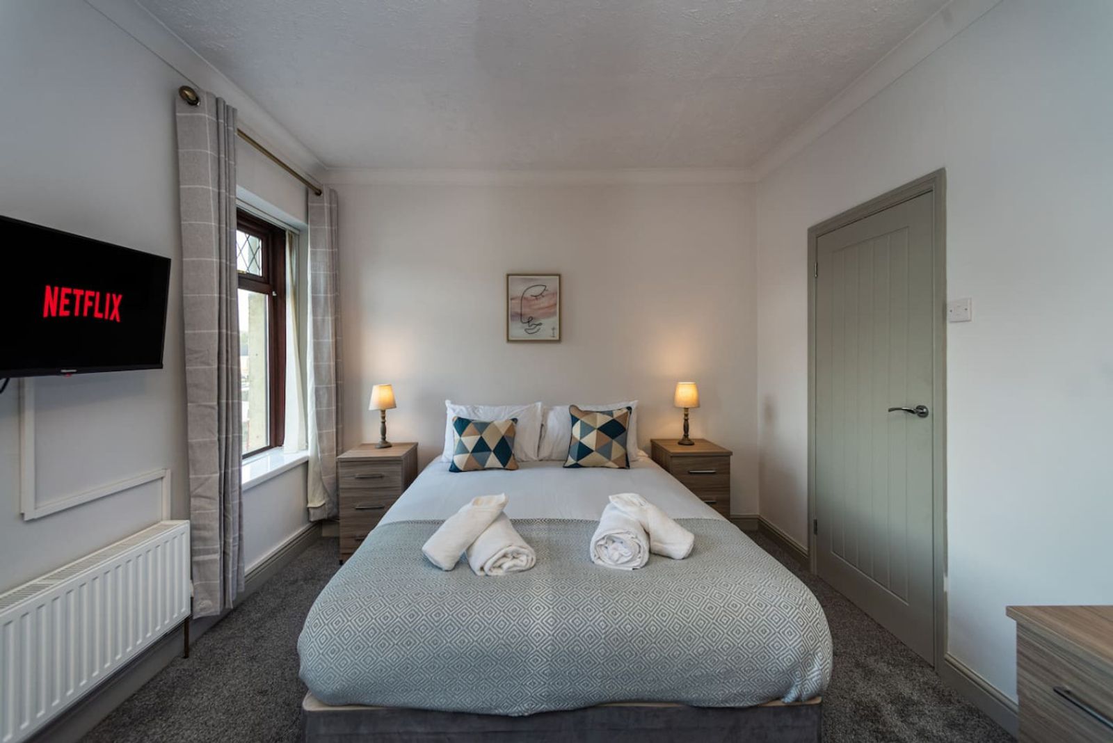 Double bedroom with smart TV in a KG property